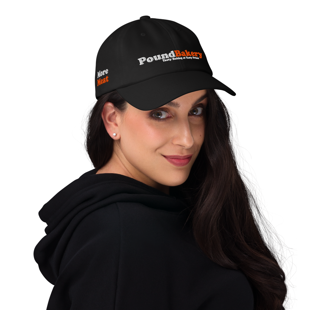Woman wearing a black cap with 'Pound Bakery' logo on a white background