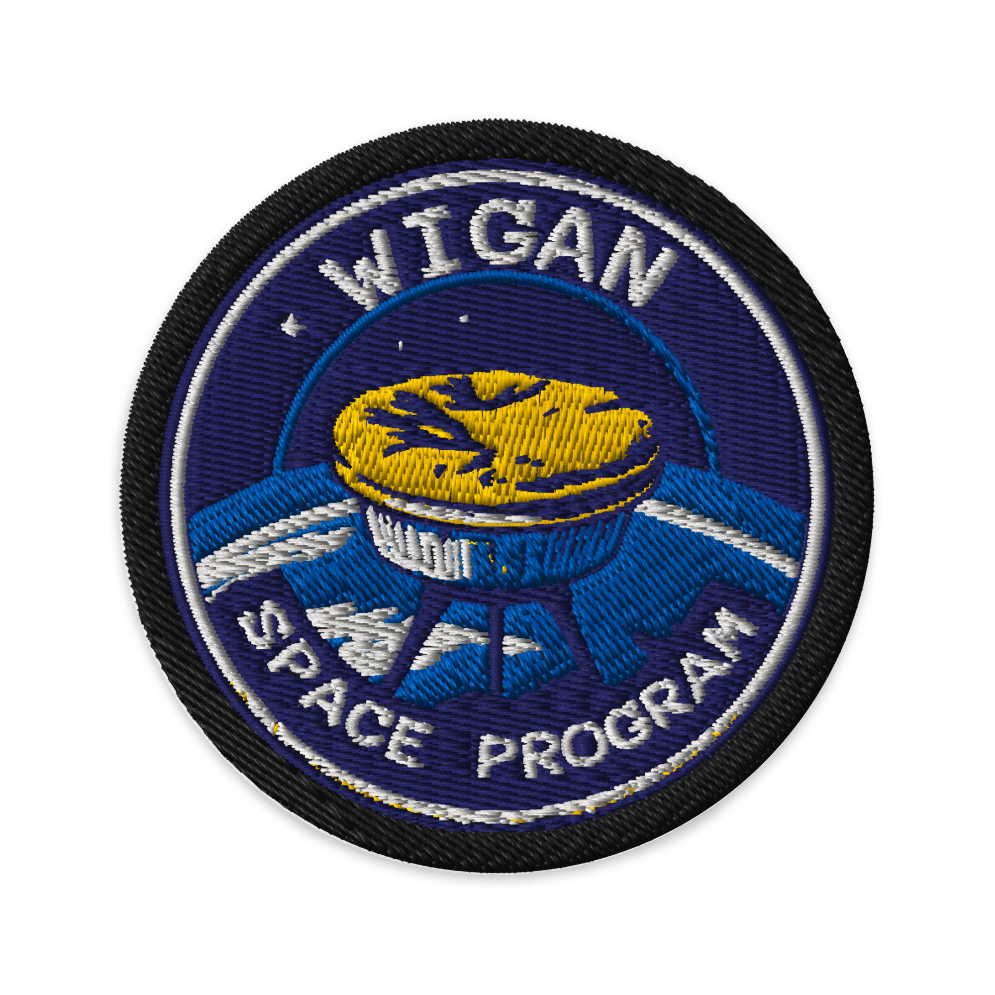 Circular patch with 'Wigan Space Program' text and space-themed design on a white background