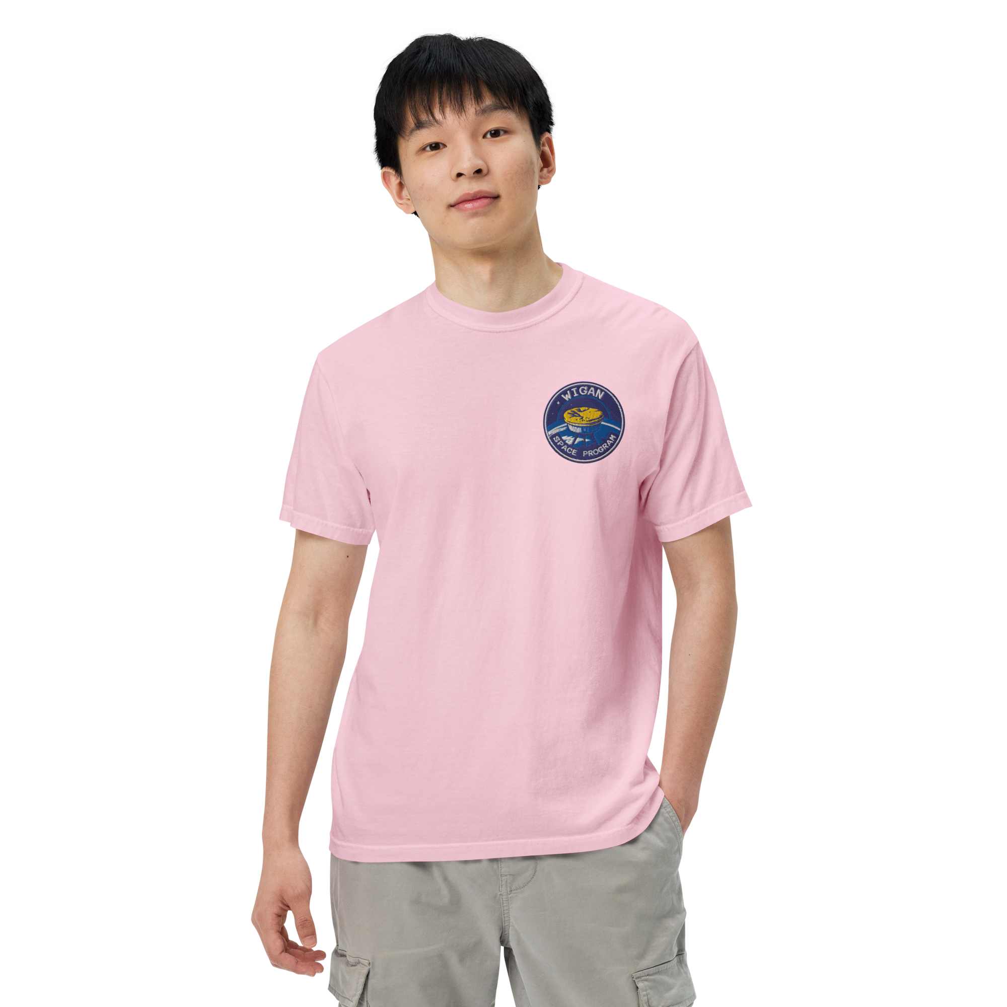 Person wearing a pink t-shirt with a logo on a white background