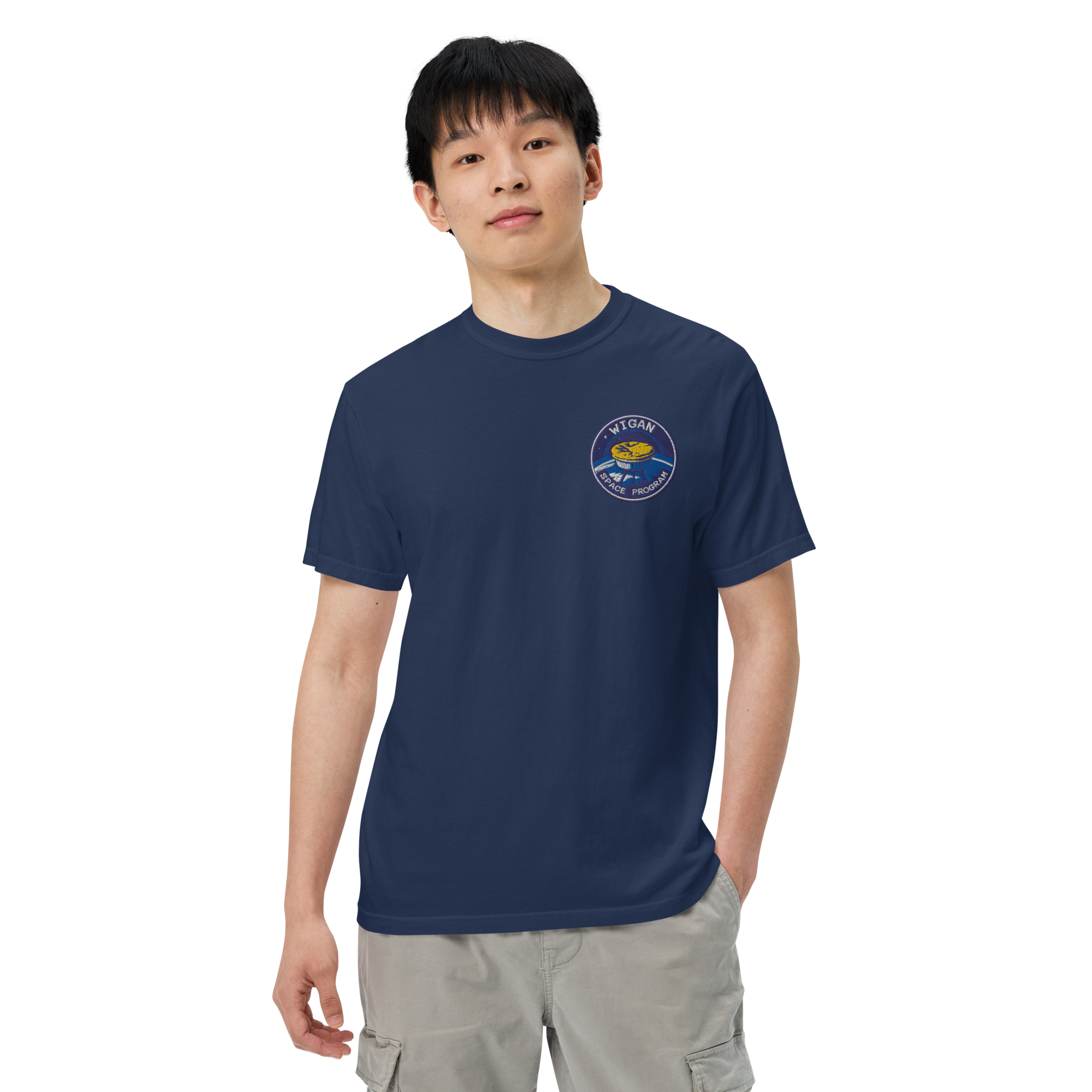 Person wearing a navy blue t-shirt with a logo on a white background