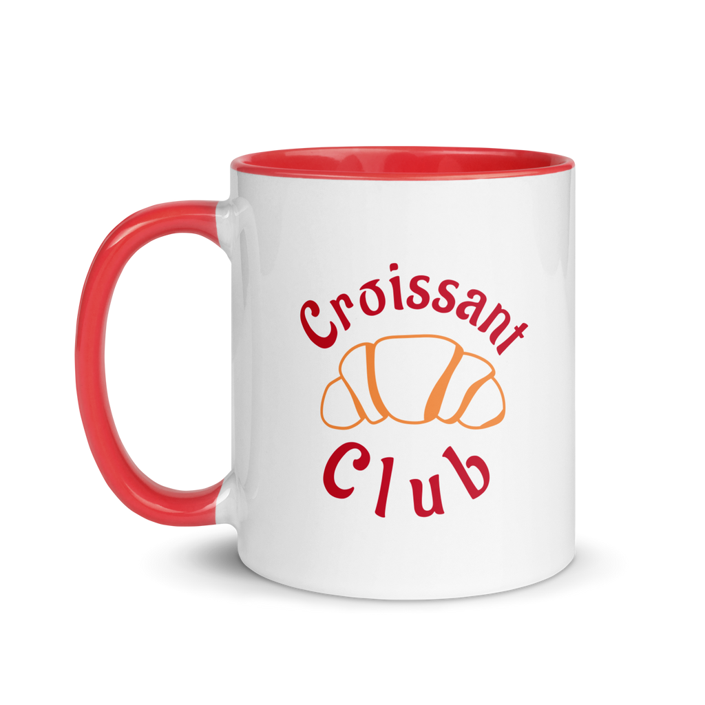 White mug with red handle and interior, featuring 'Croissant Club' text and croissant illustration on a white background.